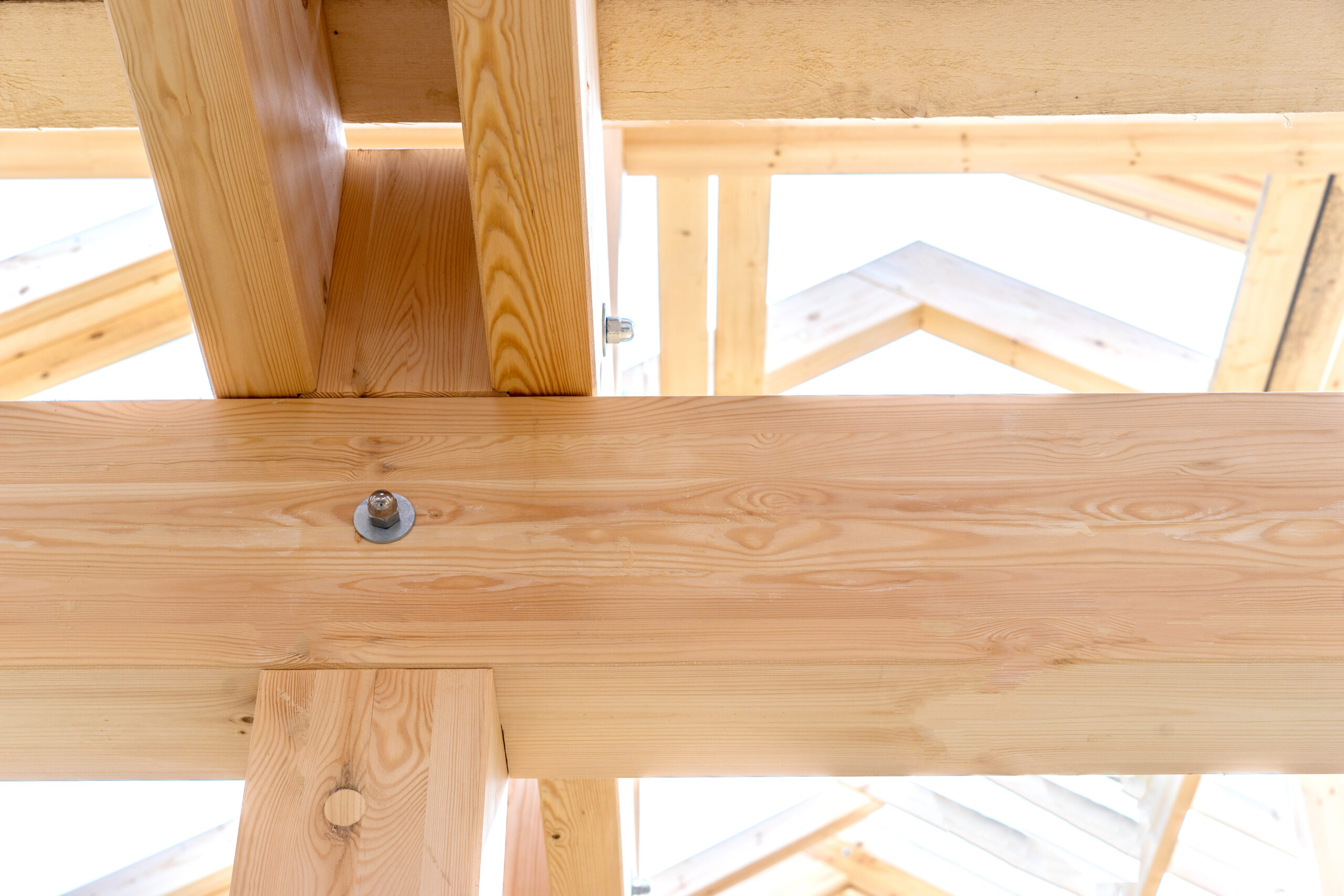 Fragment of a wooden house. Fastening of beams of a building. Fragment of building a house. Connections of wooden structures. Building concept.